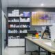a modern, well-organized pharmaceutical office radiates professionalism, showcasing sleek desks, vibrant medical products, and insightful charts on success strategies for pcd pharma franchises in 2024, bathed in bright, natural light.