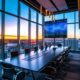 a modern conference room showcasing a digital dashboard displaying impressive reviews and ratings of third-party syrup manufacturers, with sleek furniture, ambient lighting, and a city skyline visible through expansive windows.