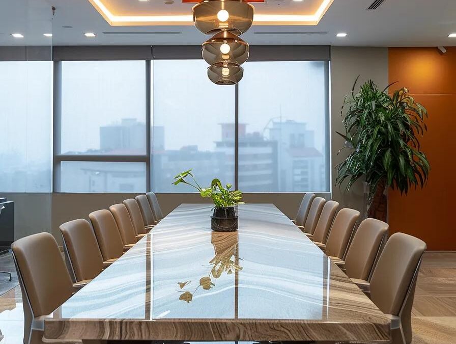a modern conference room in chennai with a sleek glass table, top-tier technology presentations on display, and professionals engaged in dynamic discussions about selecting and succeeding with pcd pharma franchises.