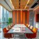 a sleek office interior in jammu, featuring a modern conference table surrounded by vibrant banners showcasing the pcd pharma franchise, conveying an atmosphere of professionalism and entrepreneurial ambition.